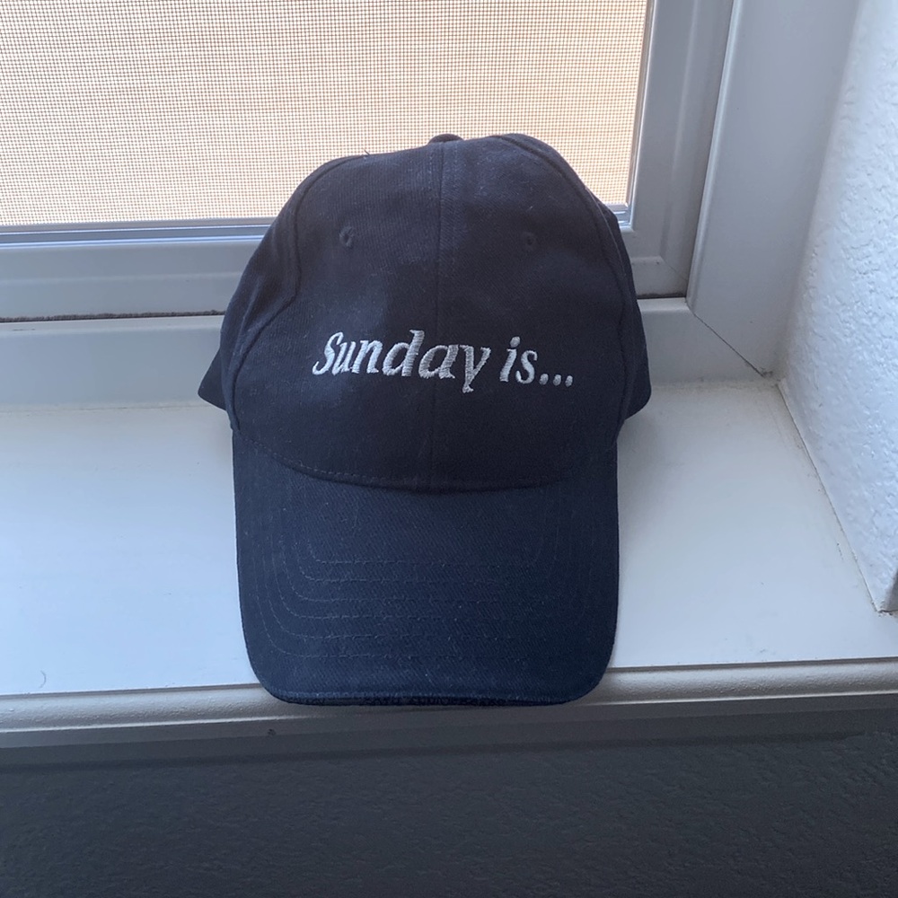Navy cotton hat, embroidered lettering front and back. Adjustable to fit most.
